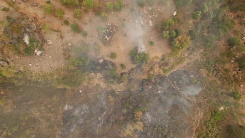 Aerial View of Wildfire Aftermath, Smoke Rising
