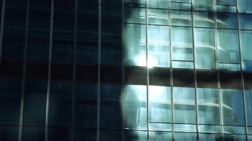 Sunlight Reflecting on Modern Building Glass Facade