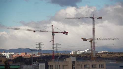 Construction Cranes Building in a City, Daytime