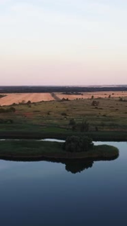 Scenic Aerial View of Island on Lake at Dusk