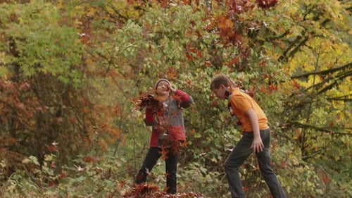Autumn Kids Throwing Leaves in Slow Motion