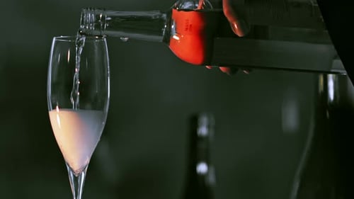 Champagne being poured into glass at event