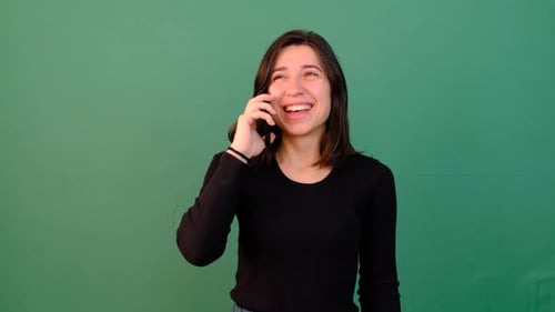 Smiling Woman Chatting on Phone on Green Screen