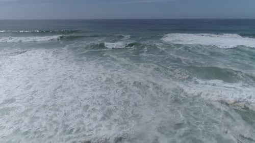 Fly over ocean water surface in Sunny Day
