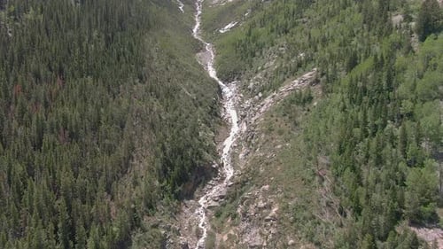 Aerial view of a beautiful 1,200-foot waterfall in Marble Colorado