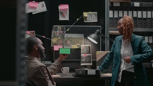 Law Agents Team Analyzing Phone with Green Screen