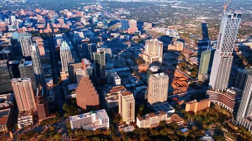 Sun dazzles the panorama of modern Austin, Texas, USA.