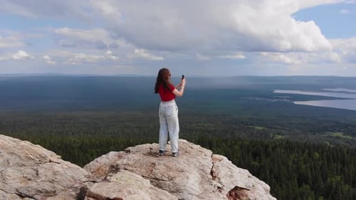 Young Girl Took a Photograph of the Breathtaking View From the Top of the Mountain