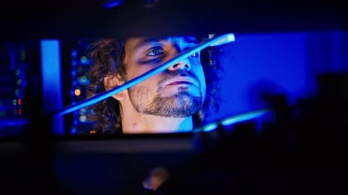 Man analysing servers in a data center