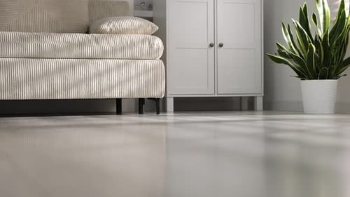 Woman walking barefoot on warm floor at home, closeup. Heating system