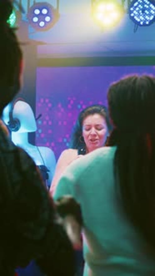 Woman Singer Performing at Colorful Nightclub