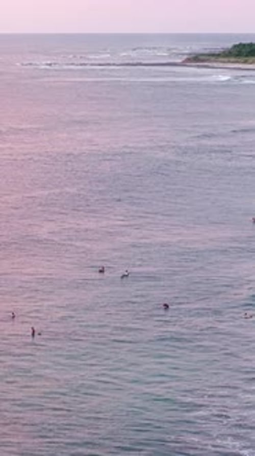 Surfers Waiting for Waves at Sunset in Avellanas Beach Costa Rica