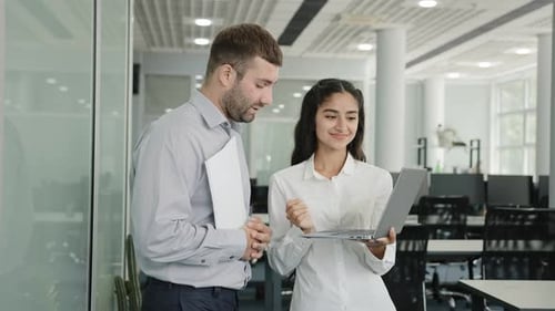 Positive Friendly Colleagues Chatting in Office Discussing Project Details Young Female Employee