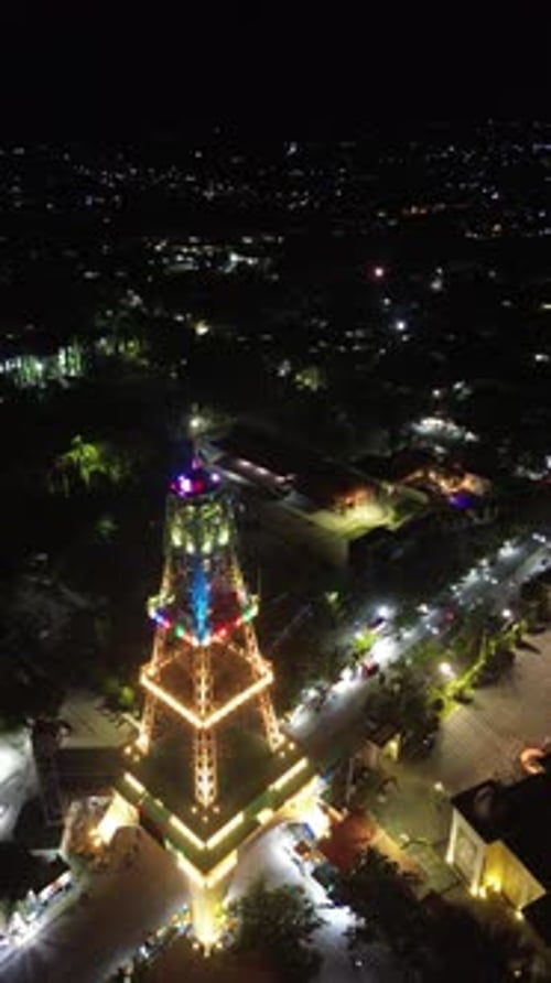 Vertical drone footage of Limboto Majesty Tower or Pakaya Tower at night