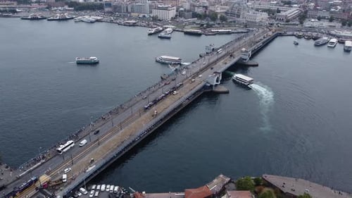 Aerial drone footage of stunning galata bridge in istanbul with, bosphorus, ships and ferries in the