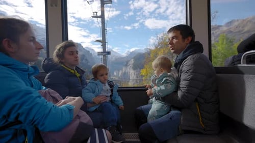 Big Family with Little Children Travels By Train in Highland