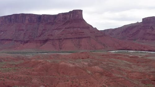 Aerial view, drone fly backward shot bottom up, majestic buttes of monument of red rocks canyon in v