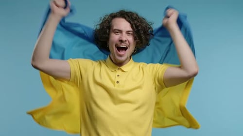 Adult Holding a Flag and Cheering