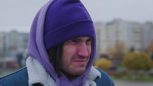 Portrait of Man Sniffling in Cold Weather Standing on City Street