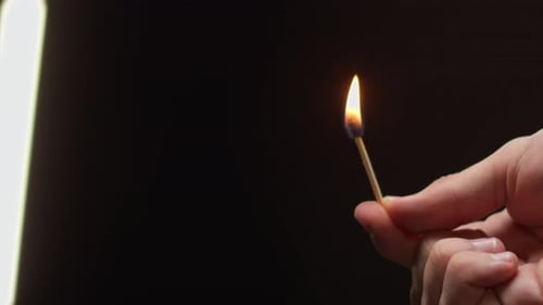 Burning Matchstick Close Up Shot on Black