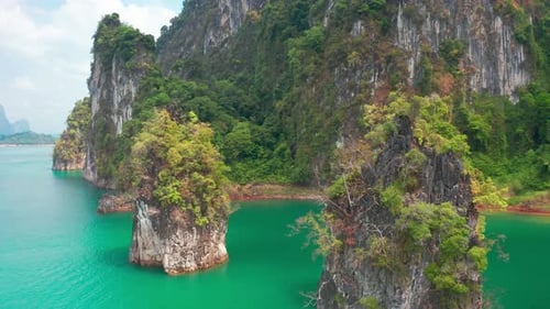 Three limestone rocks Three Brothers at Cheow Lan Lake, Khao Sok National Park, Surat Thani Province