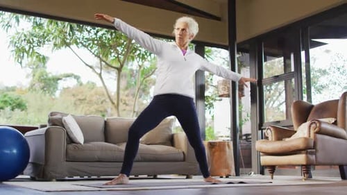 Senior Woman Doing Yoga in Her Home