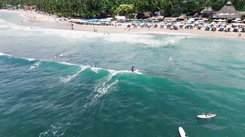 Drone Follows Surfer Riding The Wave In Sayulita, Mexico