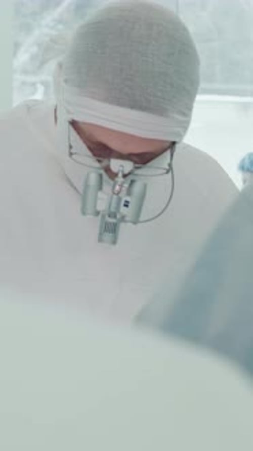 Surgeon Performing Operation in Hospital Operating Room