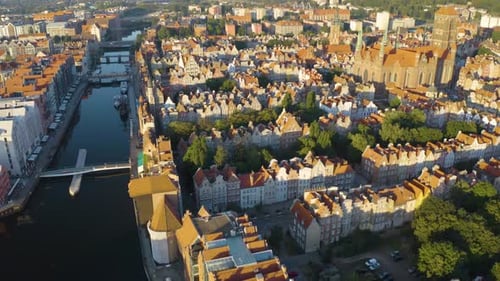 Birds Eye View of Old Town in Downtown Gdansk. Aerial Pullback Reveal. Pan Up