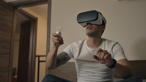 Man Immersed in Virtual Reality Gaming at Home
