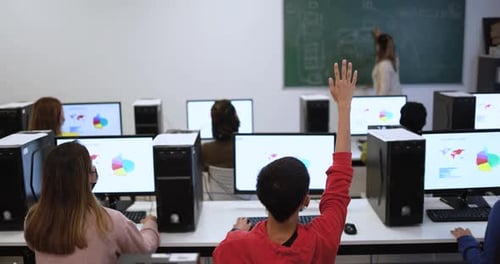 Multiracial Students Using Computers Inside Class Room Wearing Safety Masks During Coronavirus