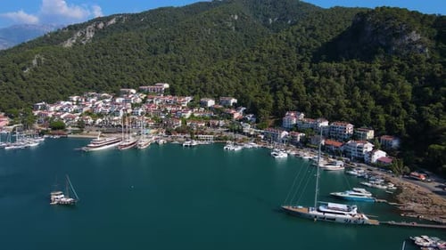 Beautiful view of the beach with boats, pure nature, sea and ships. Shot from a drone.