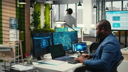 Man Working on AI at Computer Workstation