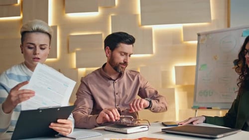 Team Receives Coffee During Office Meeting