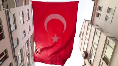 Really big turkish flag in slow motion and sunlight leaks, turkey country