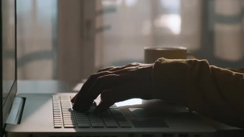 Male Hands Typing Keyboard on Laptop Computer Man Working Online at Home Searching Information