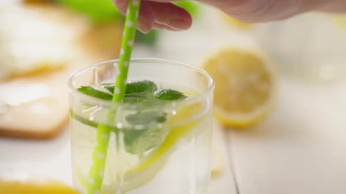 Refreshing Lemon and Mint Drink with Straw