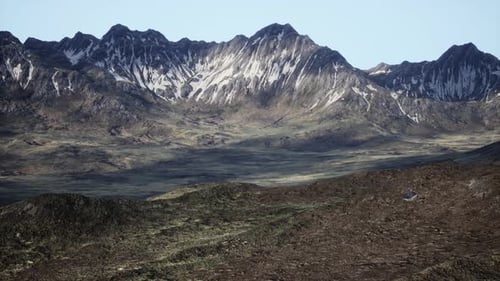 A Breathtaking View of Majestic Mountain Peaks in the Distance