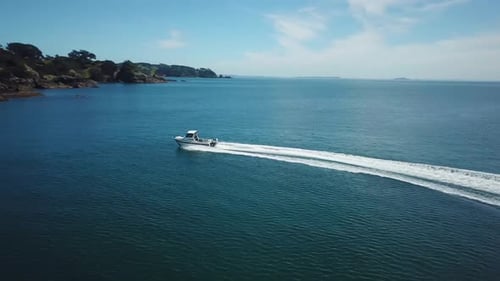Aerial drone 4k cinematic footage. Flying above speed boat on the blue sea. sideways over fast movin