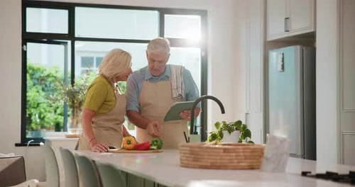 Man and Woman Preparing Food in Modern Kitchen