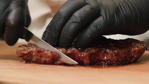 Beef Angus Steak in Restaurant Close Up Pieces of Hot Ribeye Steak Served on the Wooden Board Medium
