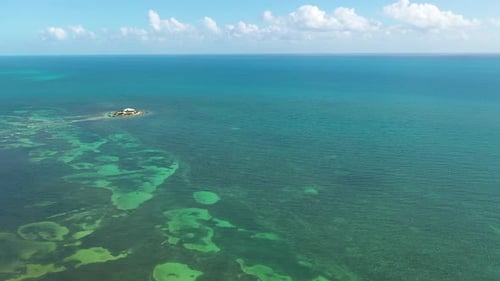 Private island surrounded by coral reef