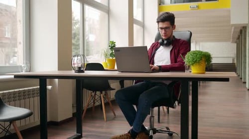 Young Stylish Freelancer Working with Laptop Then Looking at Camera Office Worker Typing on Pc
