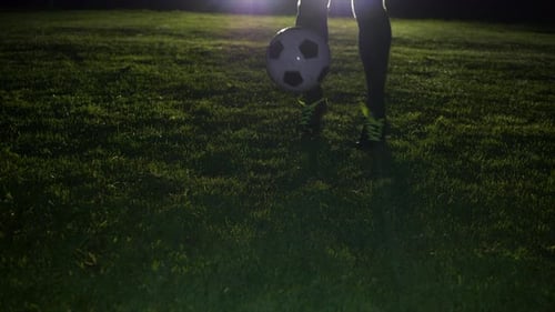 Soccer Player Athlete Training Foot Ball Sport on Soccer Field at Night