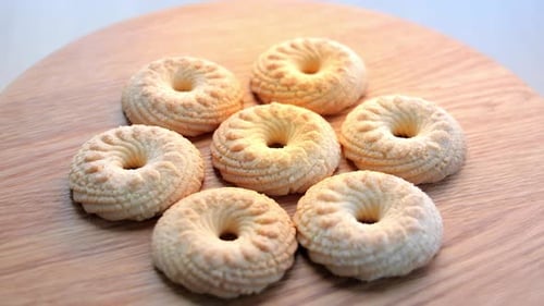 Ring-Shaped Cookies on a Wooden Surface