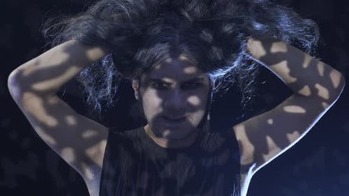 Man with Long Hair and Makeup Performs