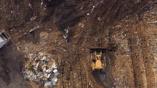 Top View of Garbage Landfill and Bulldozers