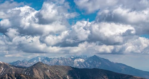 Majestic Mountain Range with Rolling Clouds Time Lapse