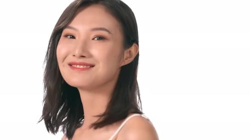 Smiling Young Adult Woman with Dark Hair Posing