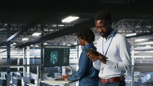Engineer Walking on Data Center Industrial Platform Performing Maintenance